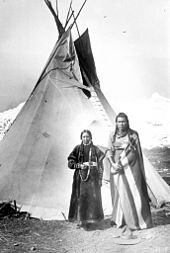 A Nez Perce tipi Nez-perce-couple-teepee-1900.jpg