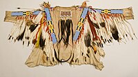 Nez Perce man's beaded and quilled buckskin shirt with eagle feathers and ermine pelts, c. 1880-85