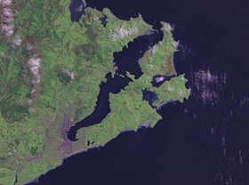 NASA satellite photo of Otago Peninsula and Otago Harbour. The city of Dunedin is located at the isthmus at lower left. Otago harbour landsat.jpg