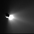 This image shows the view from Deep Impact's flyby spacecraft as it turned back to look at comet Tempel 1. Fifty minutes earlier, the spacecraft's probe was run over by the comet. That collision kicked up plumes of ejected material, seen here streaming away from the back side of the comet. This image was taken by the flyby craft's high-resolution camera.