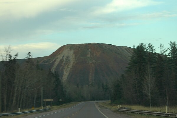 Waste rock piles from the Empire Mine along M-35 southbound approaching Palmer