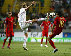 Danny and Christian Poulsen challenge for the ball during Portugal's 3-2 defeat to Denmark on 10 September 2008. Portugal 2-3 Denmark, Poulsen vs. Danny.jpg