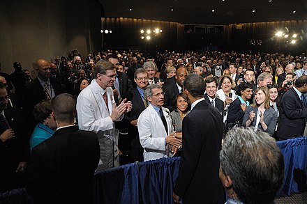 President Barack Obama greets Fauci in June 2014.