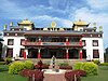 Priests heading for morning prayer at Namdroling Monastery