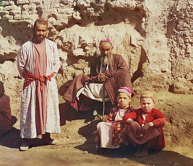 Two Sart men and two Sart boys in Samarkand, c. 1910