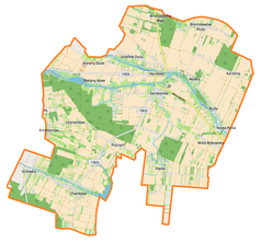 Mapa konturowa gminy Serokomla, w centrum znajduje się punkt z opisem „Poznań”