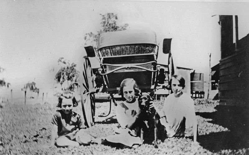 File:StateLibQld 1 119944 Three children sitting on the road with their dog, Cribb Island, ca. 1920.jpg