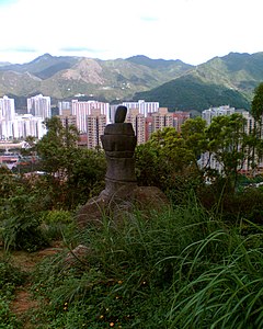 The replica of Amah Rock at Tao Fung Shan; According to Cantonese legends, a woman turned into a stone statue by standing at the seaside waiting for her husband to return home. TaoFungShan AmahRock.jpg