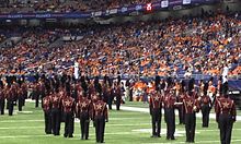 The Bobcat Marching Band performs during halftime of a football game