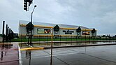 Photo of the Don Hutson center, with a fence and grass field in the foreground