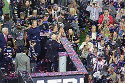 A four-time Super Bowl MVP with the Patriots (the NFL-record for the most with one franchise), Tom Brady is seen celebrating the Patriots' dramatic comeback victory over the Atlanta Falcons in Super Bowl LI Tom Brady with Vince Lombardi trophy.jpg