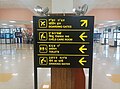 Trilingual signboard in the Imphal International Airport (Tulihal International Airport) displaying in Meitei, Hindi and English languages.jpg