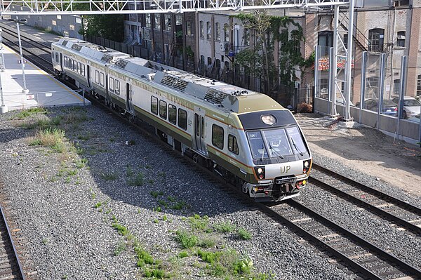 A UP Express Nippon Sharyo two-car DMU in service