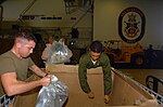 Thumbnail for File:US Navy 071127-N-1831S-202 Marines aboard USS Kearsarge (LHD 3) load water into boxes that will be delivered to the damaged areas. Kearsarge and embarked 22nd Marine Expeditionary Unit.jpg