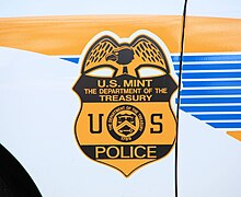 United States Mint Police badge displayed on patrol unit United States Mint police symbol.JPG