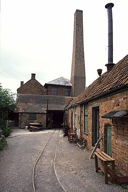 The light rail track leading to the pump house, with the forge to the right Westonzoyland Pumping Station - geograph.org.uk - 676871.jpg