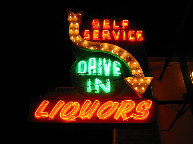 An iconic sign lights up a liquor store in Wildwood, which has more than 60 active liquor licenses