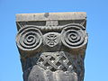 A capital adorning the top of one of the temple columns.