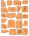 Morceaux de céramique portant des signes semblables à des formes d'écriture.