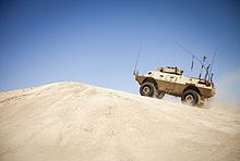 A M1117 navigates through an obstacle at a rough terrain driving course 130513-M-RO295-172.jpg