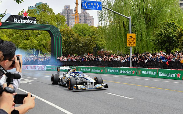 The HF1-018 with special livery driven by Jessica Hawkins during F1 Shanghai Festival