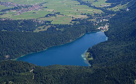 Aerial view of the Alpsee from the southwest. The castles Hohenschwangau and Neuschwanstein can be made out at the far end of the lake and the top right corner of the image respectively (view the image for annotations)