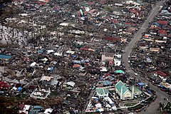 Image 5Aerial image of destroyed houses in Tacloban, following Typhoon Haiyan (from Effects of tropical cyclones)