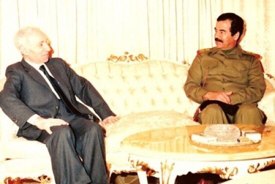 Saddam Hussein (right) talking with founder of Ba'athism and Ba'ath Party leader Michel Aflaq in 1988.