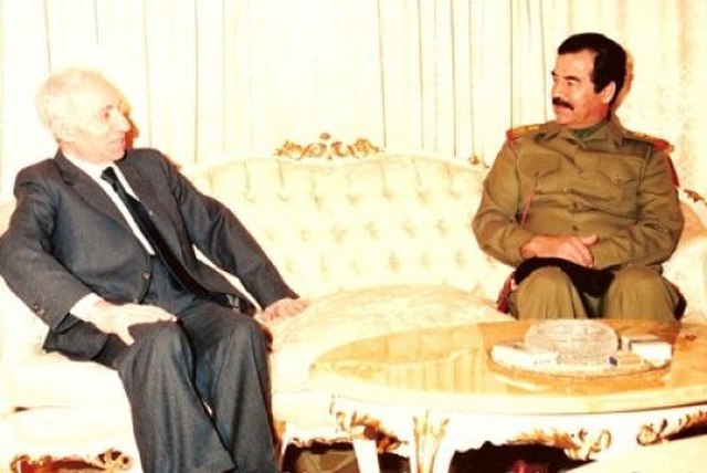 Saddam Hussein (right) talking with Aflaq (left) in 1988.