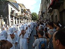 A Catholic Christian procession with battenti (beaters) mortifying the flesh with spugnas in the Italian city of Guardia Sanframondi Battenti guardia1.jpg