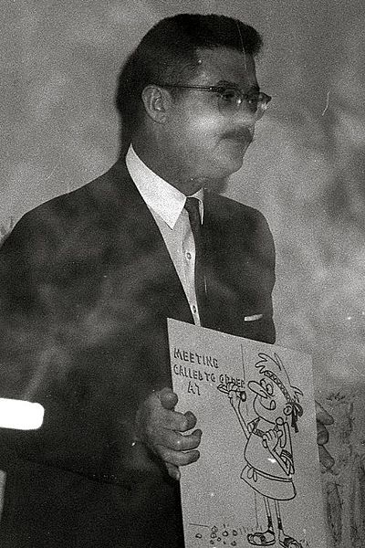 Scott holding one of his drawings, 1962
