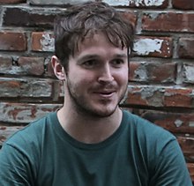 Brad Troemel talks over drinks with New York Arts Practicum participants after leading the last 2014 seminar (14794513349) (cropped).jpg