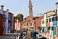 Burano, with its colorful houses and a tilted church tower.