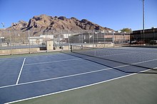 This is a picture of the Canyon Del Oro High School tennis courts in Oro Valley.  Pusch Ridge is in the background.