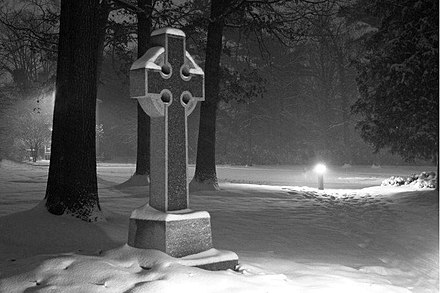 Illuminated Celtic cross, Bon Air Presbyterian Church, Virginia, in snow storm at night