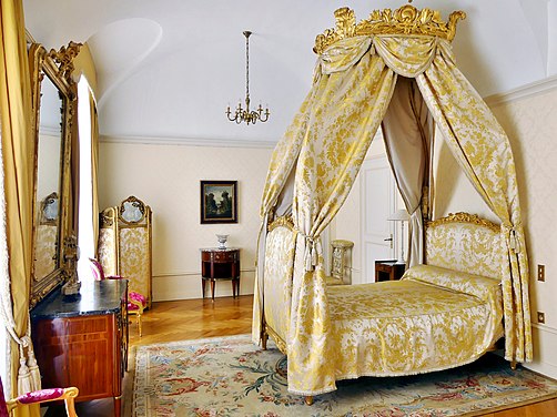 A historical 18th-century Polish bed (lit à la polonaise) at Chambéry, France