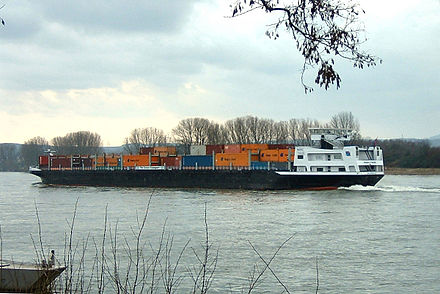 A riverboat-"container ship" with the capacity for 500 intermodal containers of the TEU size.