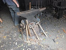 Blacksmith's anvil mounted on a log Craft blacksmiths anvil at Anson 6002.JPG