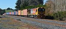 DL9302 hauling a freight train between Pokeno and Tuakau, 4 June 2014.