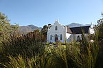 This church, with its neo-Gothic and Cape-Dutch architectural features, was built at the instance of the Rev. P. N. Ham, shortly after the local congregation had broken away, in 1845, from the Paarl congregation. Type of site: Church Current use: Church : Dutch Reformed. Dutch Reformed Church, Franschhoek, Paarl District.JPG
