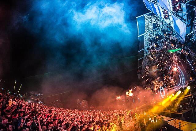 An EDM festival in 2013 in Plainfeld, Austria with over 100,000 attendees, exhibiting the large crowds and dramatic lighting common at such events sin