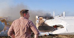 Elon Musk overlooking the remains of F9R (36411051713).jpg