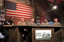 Curt Menefee, Terry Bradshaw, Howie Long, Michael Strahan, and Jimmy Johnson in Afghanistan during a taping of the FOX NFL Sunday pregame show, 2009