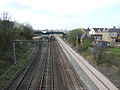 The view west from Carlisle Street bridge to the island platform and footbridges/access ramps of the station, with the mainline double track on the right 31 March 2012