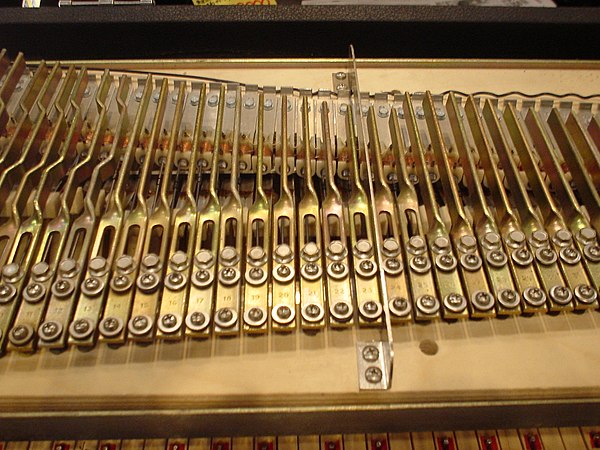 The Rhodes piano generates its sound by hammers hitting a bar of metal known as a tine.