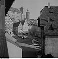 Exterior: the side of the house, looking up toward the castle