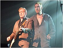 King (right) and Andy Gill performing with Gang of Four in 2011 Go4 18.jpg