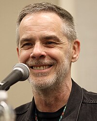 Grant Kirkhope (pictured 2024) created the orchestral score for Kingdoms of Amalur: Reckoning. Grant Kirkhope by Gage Skidmore.jpg