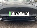 An example of the green band - on a Tesla - signifying the vehicle emits zero emissions.