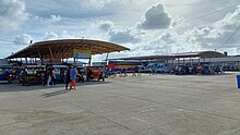 Motorized cycle rickshaws, buses and other vehicles on stand-by in the Guiuan Integrated Transport Terminal